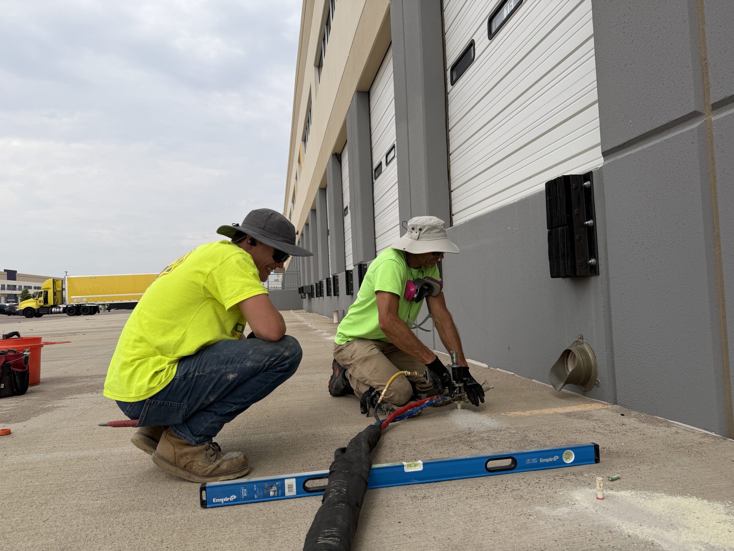 Lifting and leveling commercial loading dock concrete for compliance and safety